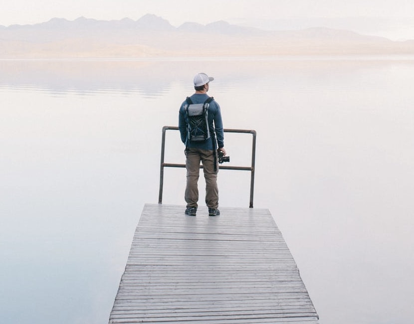 man overlooking water